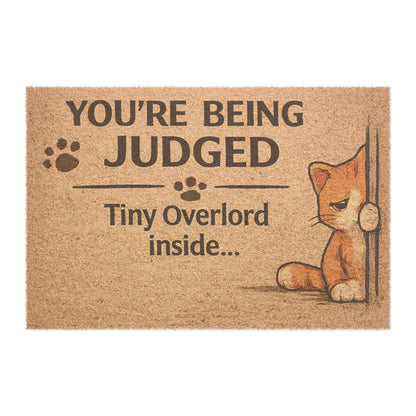 Doormat — "You're Being Judged: Tiny Overlord Inside" Cat Welcome Mat