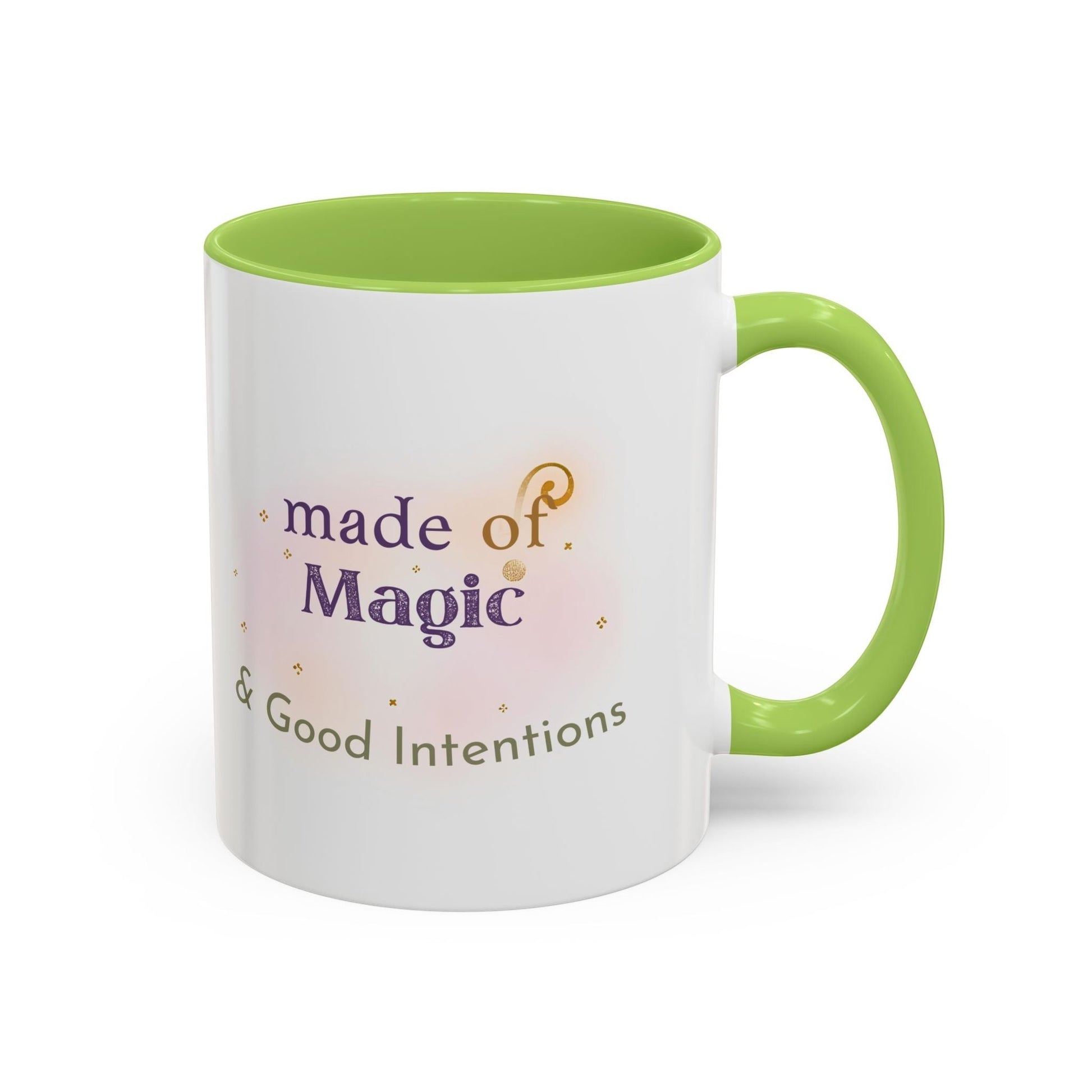 Jena Jewelry white ceramic mug with green interior and handle, featuring "made of Magic & Good Intentions" text and watercolor accents.