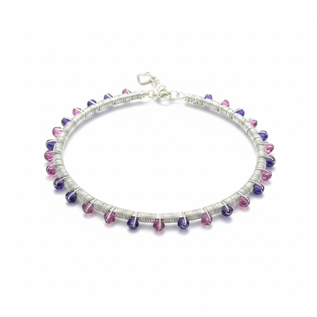 Jena Jewelry handmade wire-wrapped bangle bracelet with pink and purple glass crystals on a silver-tone wire base.