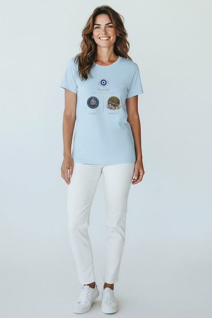 Woman wearing light blue graphic t-shirt with symbolic design, a soft and relaxed everyday style.