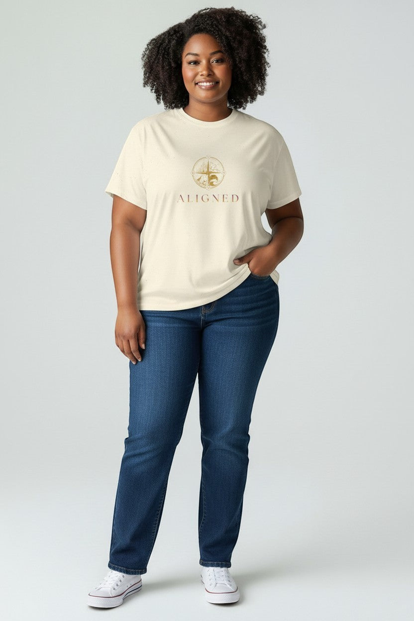 Woman wearing natural “Aligned” t-shirt, a soft neutral and mindful everyday outfit.