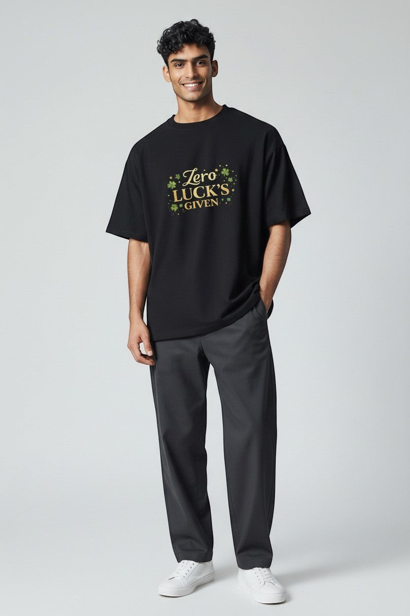 Man wearing black “Zero Luck’s Given” shirt, a bold and humorous graphic tee for everyday wear.