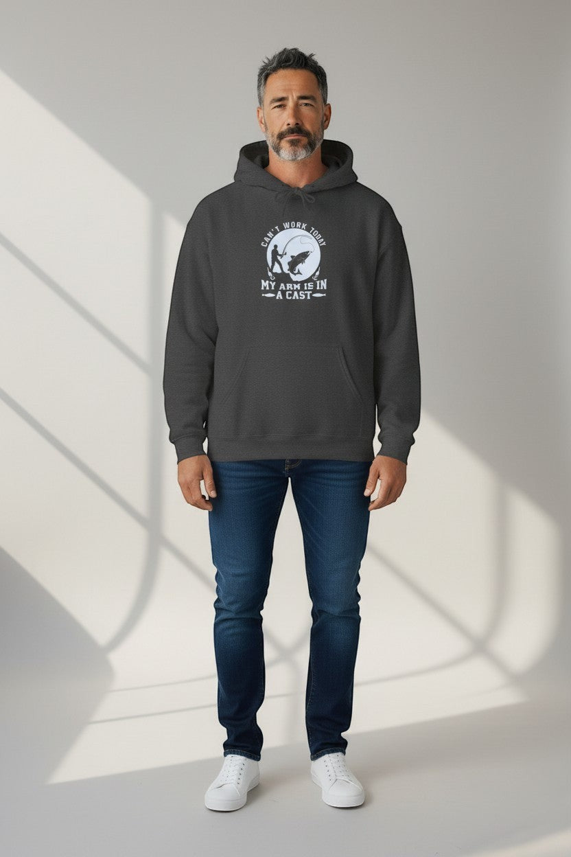 Man wearing charcoal hoodie with graphic design, a comfortable and versatile casual outfit.