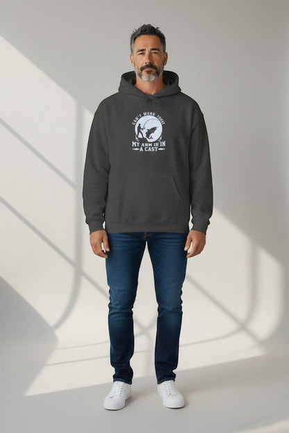 Man wearing charcoal hoodie with graphic design, a comfortable and versatile casual outfit.