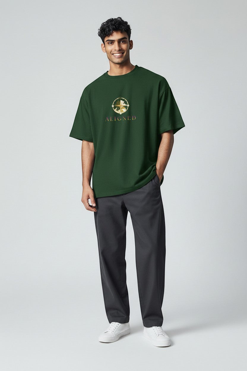 Man wearing forest green “Aligned” t-shirt, a grounded and nature-inspired style.