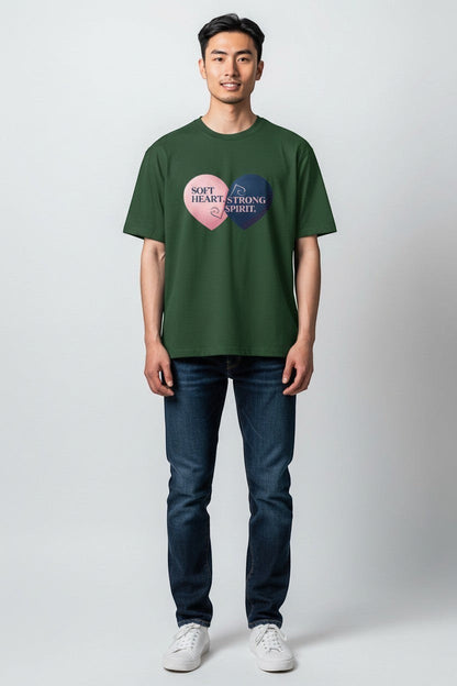 Man wearing forest green “Soft Heart Strong Spirit” t-shirt, an earthy and grounded outfit.