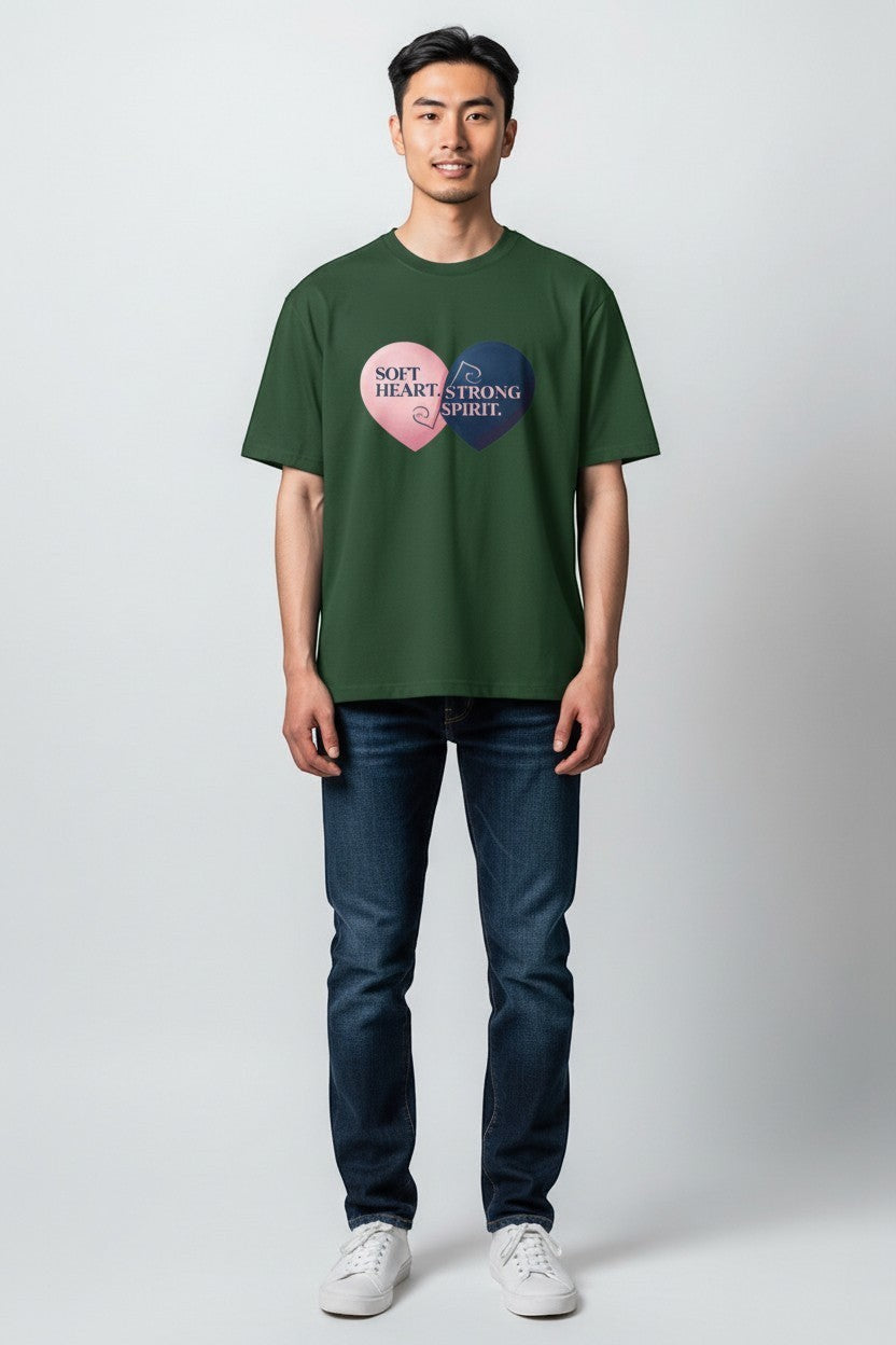 Man wearing forest green “Soft Heart Strong Spirit” t-shirt, an earthy and grounded outfit.