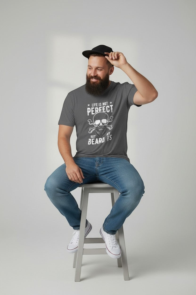 Man sitting on stool wearing charcoal beard humor t-shirt, a relaxed everyday look.e.