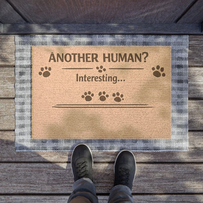 Top view of humorous cat doormat with sarcastic “Another Human?” message, perfect for playful home entrances.