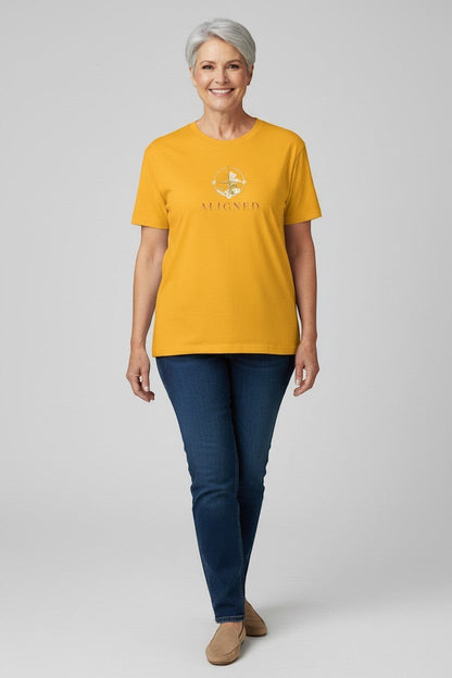 Woman wearing gold “Aligned” t-shirt, a bright and uplifting mindful look.