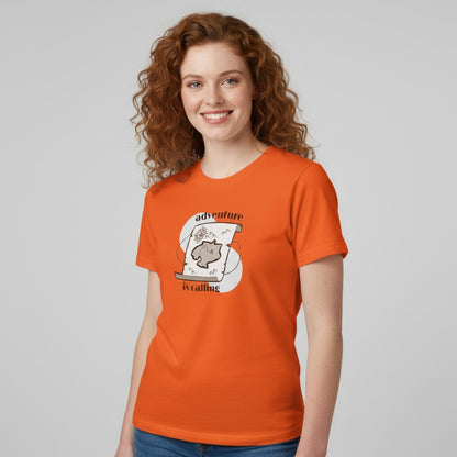 Jena Jewelry orange cotton t-shirt with a vintage treasure map graphic and the text "adventure is calling".