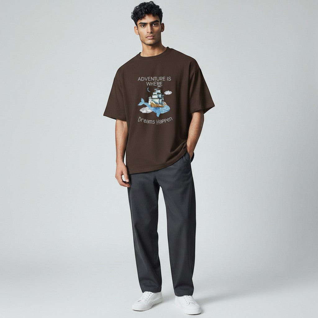 Jena Jewelry brown cotton graphic t-shirt with whale, ship, lighthouse, and clouds. Quote: Adventure Is Where Dreams Happen.
