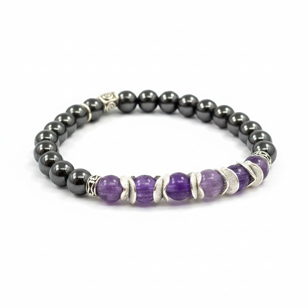 Jena Jewelry amethyst and magnetic hematite stretch bracelet with silver accents. Features purple amethyst beads and dark grey hematite beads.