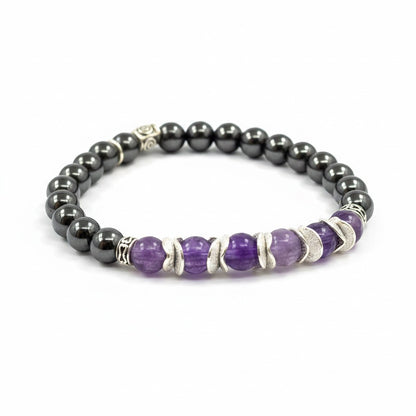 Jena Jewelry amethyst and magnetic hematite stretch bracelet with silver accents. Features purple amethyst beads and dark grey hematite beads.