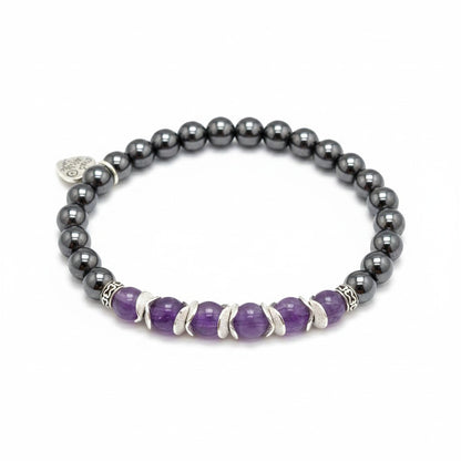 Jena Jewelry amethyst and magnetic hematite stretch bracelet with silver accents. Features purple amethyst beads and dark grey hematite beads.