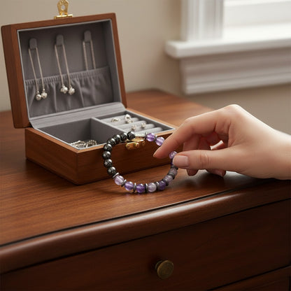 Jena Jewelry handmade stretch bracelet with amethyst, hematite, and black onyx beads for calm, strength, and spiritual shielding.