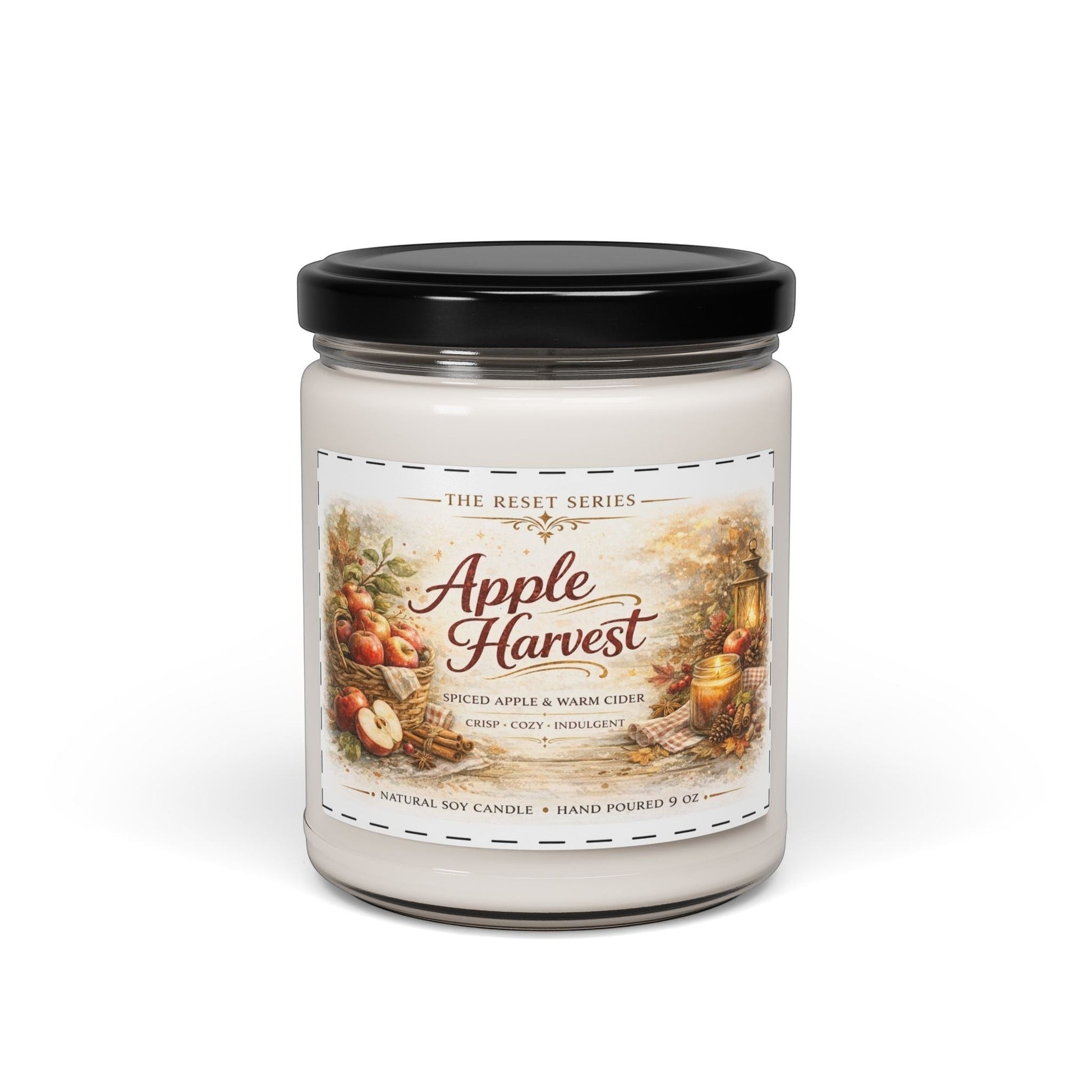 Jena Jewelry Apple Harvest soy candle with spiced apple and warm cider scent, featuring a cozy fall scene with apples and a lantern.