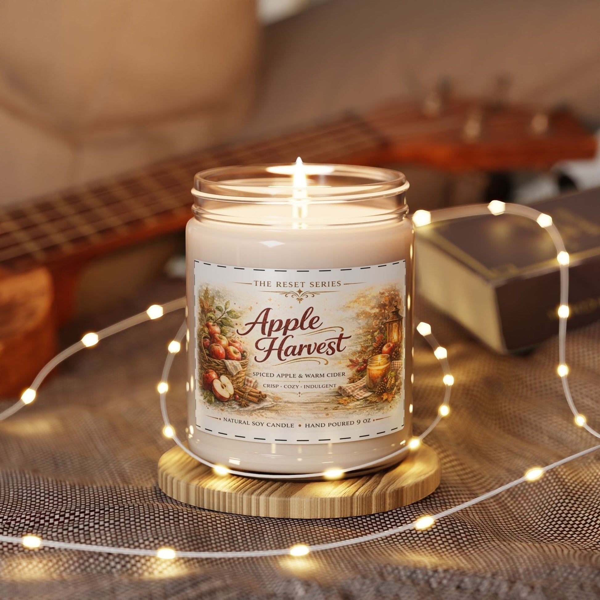 Jena Jewelry Apple Harvest soy candle with spiced apple and warm cider scent, in a reusable glass jar, perfect for fall decor.