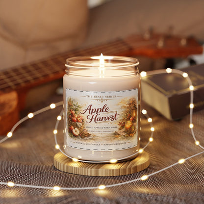 Jena Jewelry Apple Harvest soy candle with spiced apple and warm cider scent, in a reusable glass jar, perfect for fall decor.