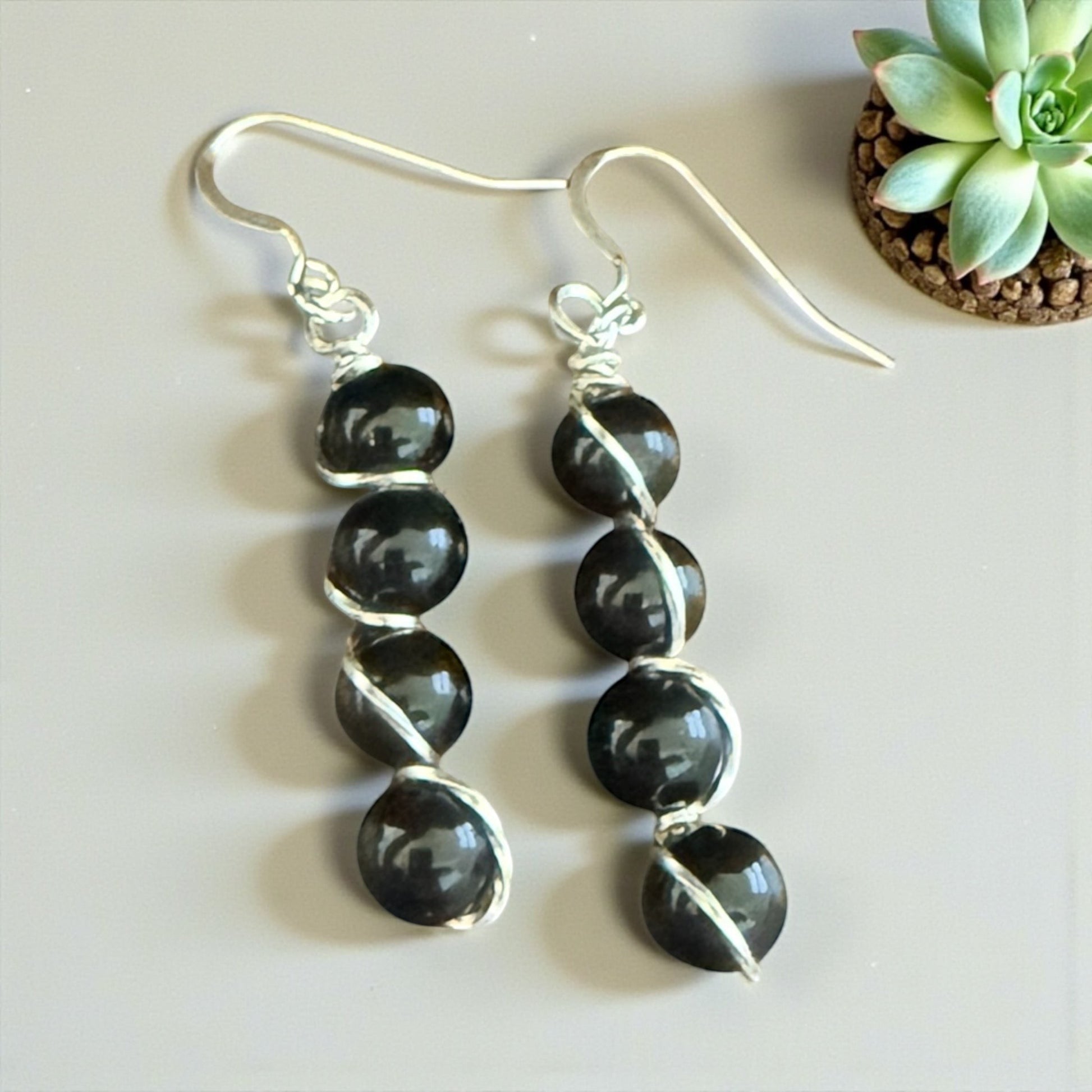 Jena Jewelry stacked black gemstone drop earrings with silver-tone wire wrapping and hypoallergenic ear wires.