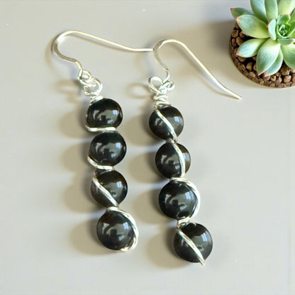 Jena Jewelry stacked black gemstone drop earrings with silver-tone wire wrapping and hypoallergenic ear wires.