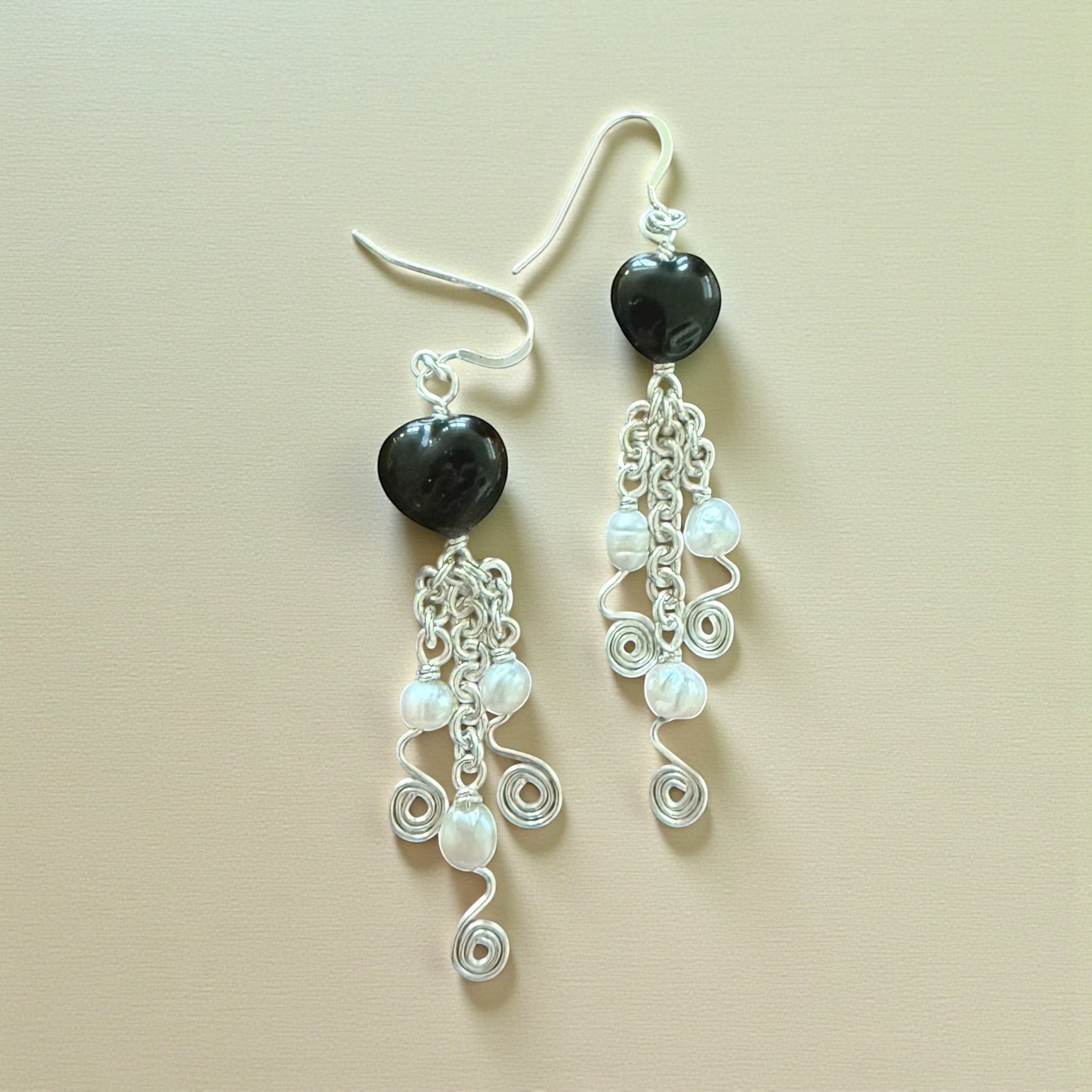 Jena Jewelry black porcelain heart earrings with freshwater pearls and silver chainmaille links.