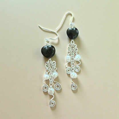 Jena Jewelry black porcelain heart earrings with freshwater pearls and silver chainmaille links.