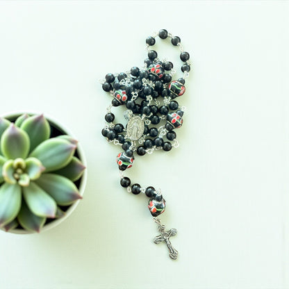 Jena Jewelry hand-wrapped rosary with black obsidian beads and floral lampwork glass beads, silver crucifix and medallion.