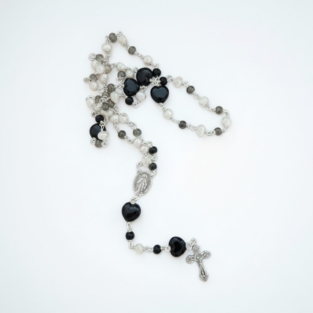 Jena Jewelry rosary with freshwater pearls, black onyx, and porcelain heart beads, silver cross and medallion.