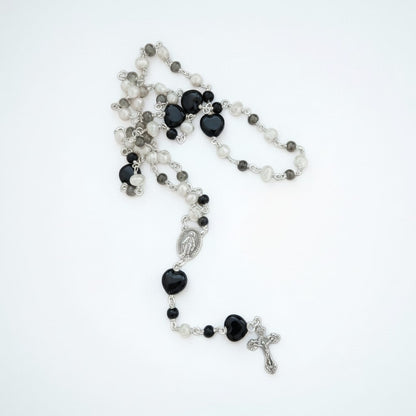 Jena Jewelry rosary with freshwater pearls, black onyx, and porcelain heart beads, silver cross and medallion.