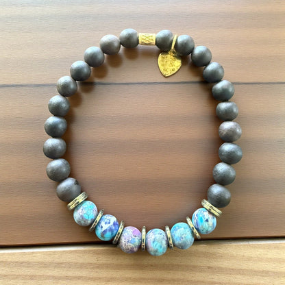 Jena Jewelry bracelet with ebony blackwood, imperial jasper, and hematite beads, featuring a gold heart charm.