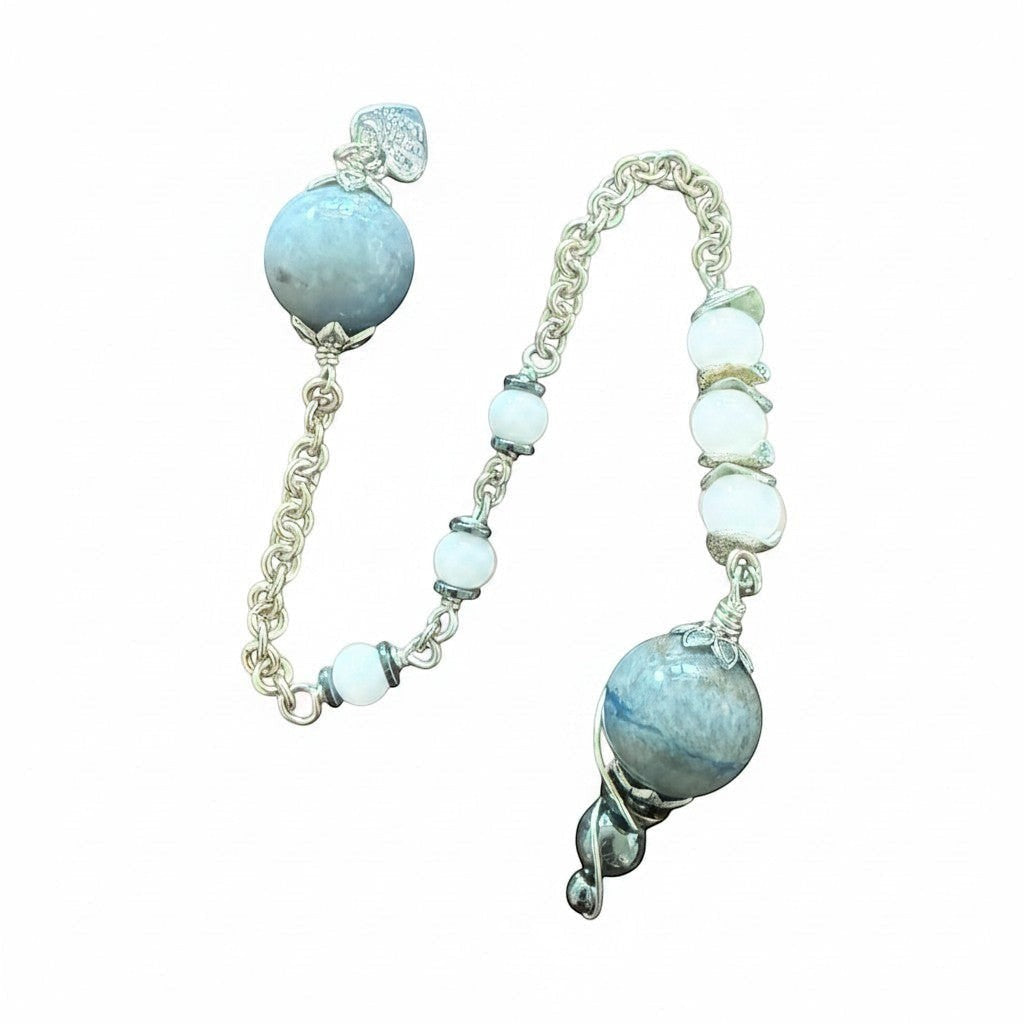 Jena Jewelry pendulum with blue aventurine, snow jade, and hematite beads on a chainmaille handle.