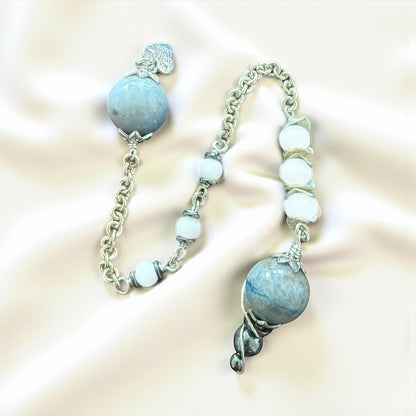 Jena Jewelry pendulum with blue aventurine, snow jade, and hematite beads on a silver chainmaille handle.