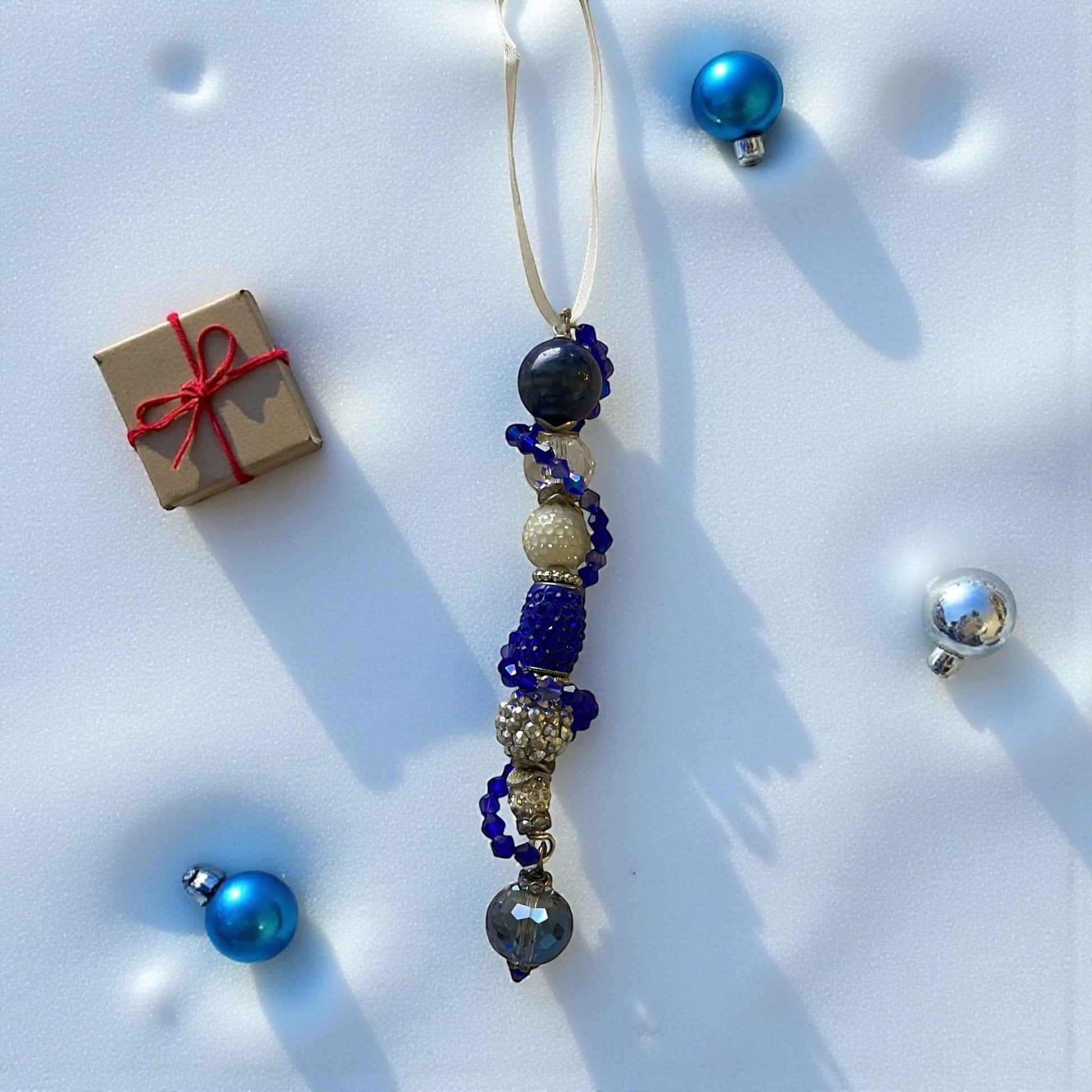 Jena Jewelry handcrafted blue and silver beaded icicle ornament with jingle bells and a heart charm.