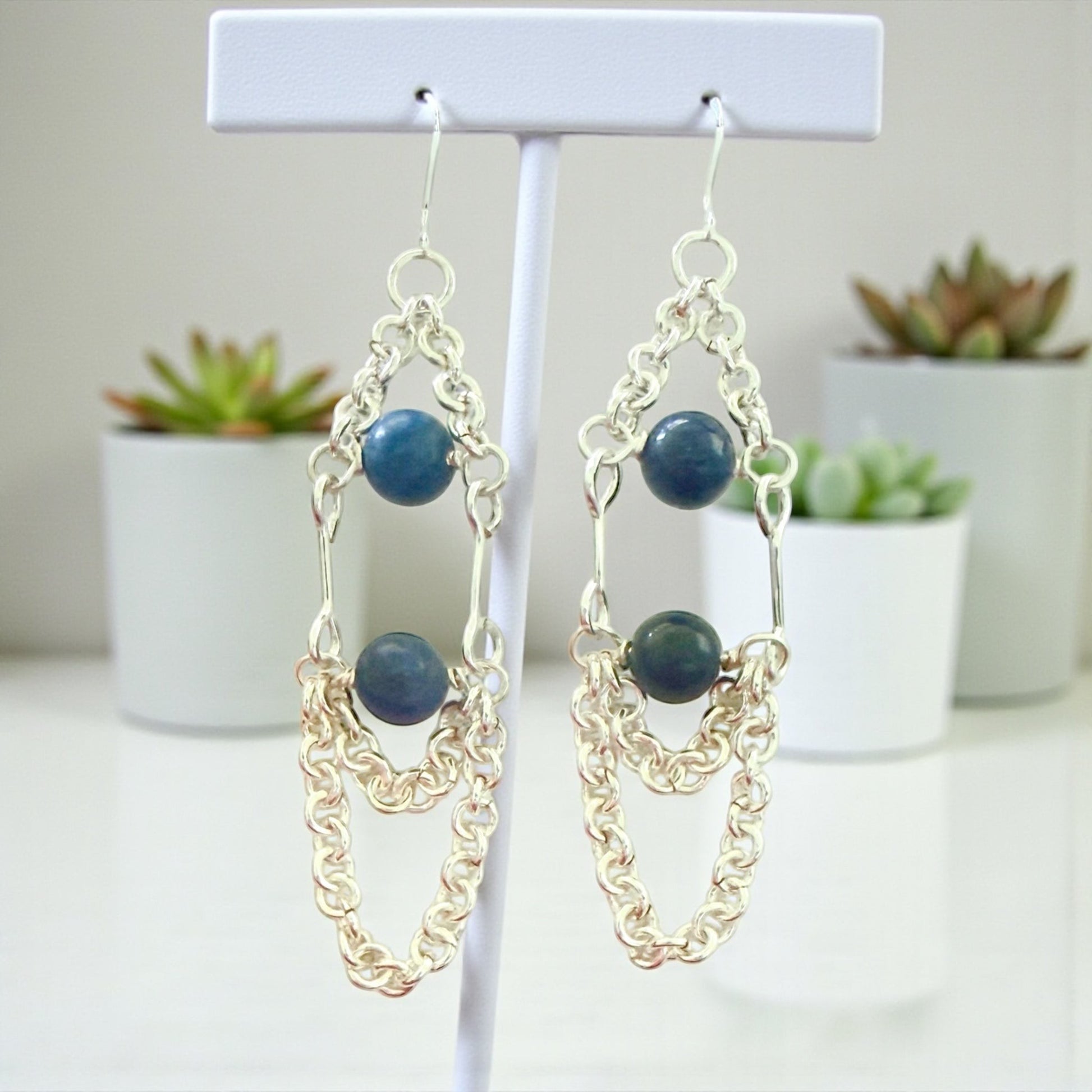 Jena Jewelry silver-filled chain link dangle earrings with two blue gemstones each. Hypoallergenic.