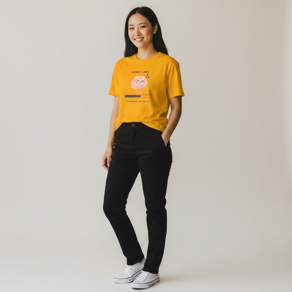 Jena Jewelry yellow 100% cotton t-shirt with a cute pink brain graphic and "One Moment... Loading – My Brain Has Too Many Tabs Open" text.