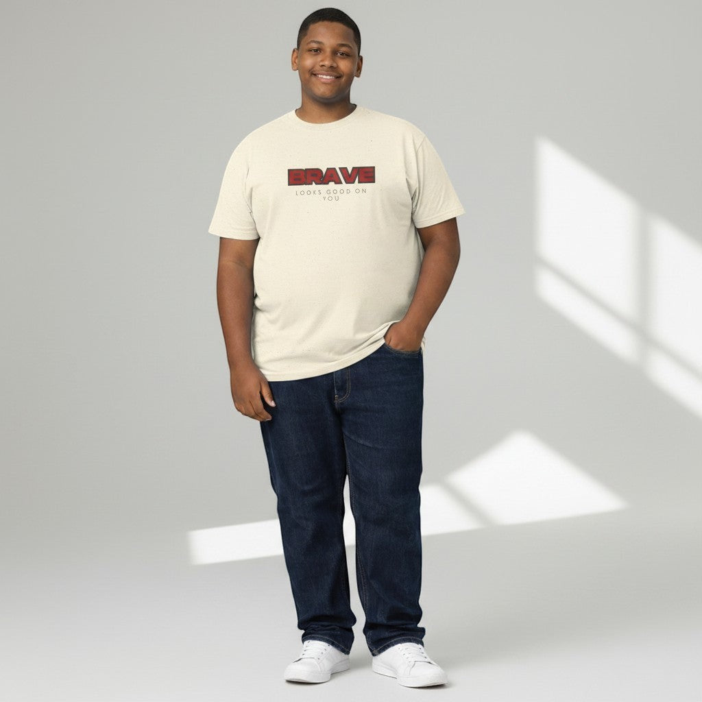 Jena Jewelry cream cotton crewneck tee with bold red "BRAVE" graphic and "LOOKS GOOD ON YOU" text.