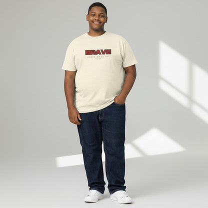 Jena Jewelry cream cotton crewneck tee with bold red "BRAVE" graphic and "LOOKS GOOD ON YOU" text.