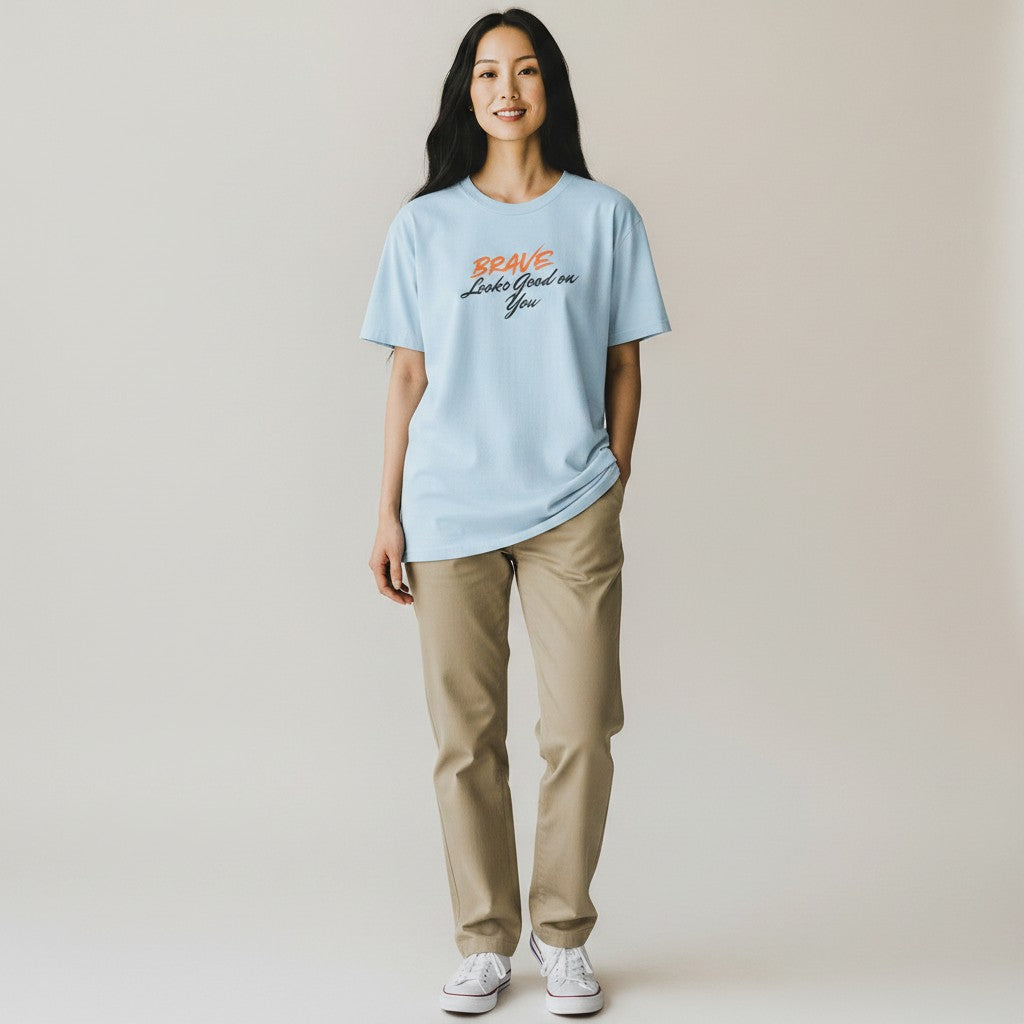 Jena Jewelry light blue 100% cotton t-shirt with "BRAVE Looks Good on You" graphic print. Classic fit, crew neck.