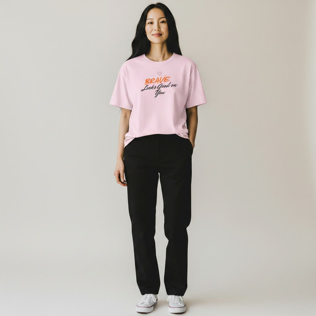 Jena Jewelry light pink 100% cotton t-shirt with "BRAVE Looks Good on You" graphic print. Relaxed fit, crew neck.