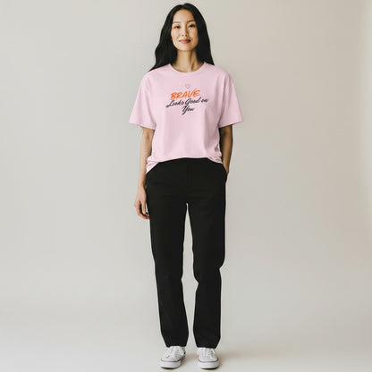Jena Jewelry light pink 100% cotton t-shirt with "BRAVE Looks Good on You" graphic print. Relaxed fit, crew neck.