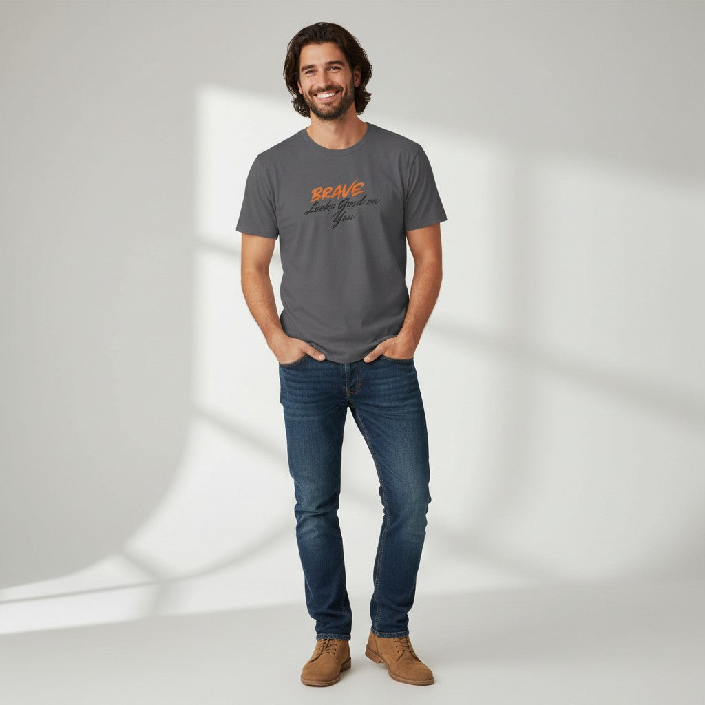 Jena Jewelry charcoal grey 100% cotton t-shirt with "BRAVE Looks Good on You" graphic print in orange and black.