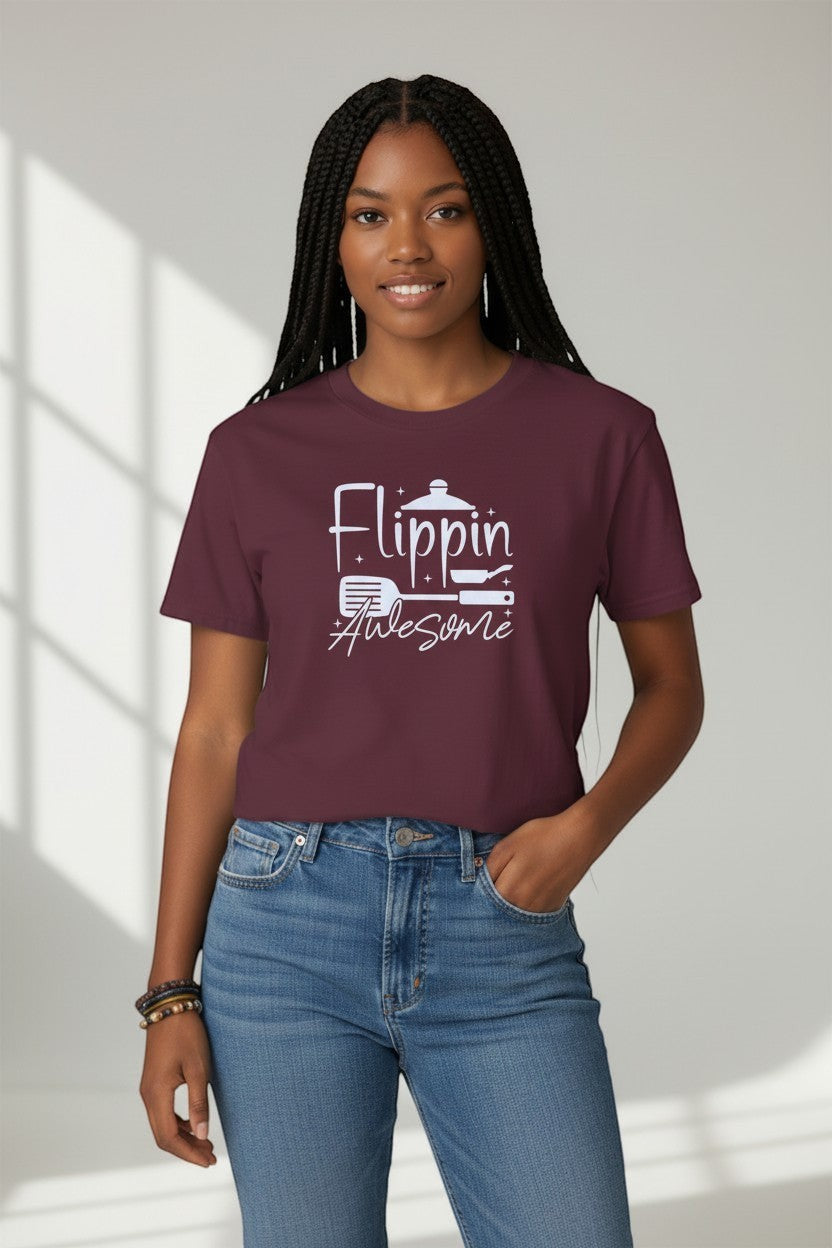 Jena Jewelry burgundy 100% cotton t-shirt with white graphic text 'Flippin Awesome' and cooking icons.