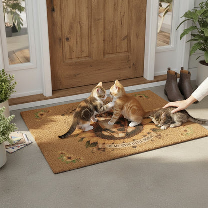 Jena Jewelry coir doormat with calico cat and sunflower print, featuring kittens playing on a porch entryway.