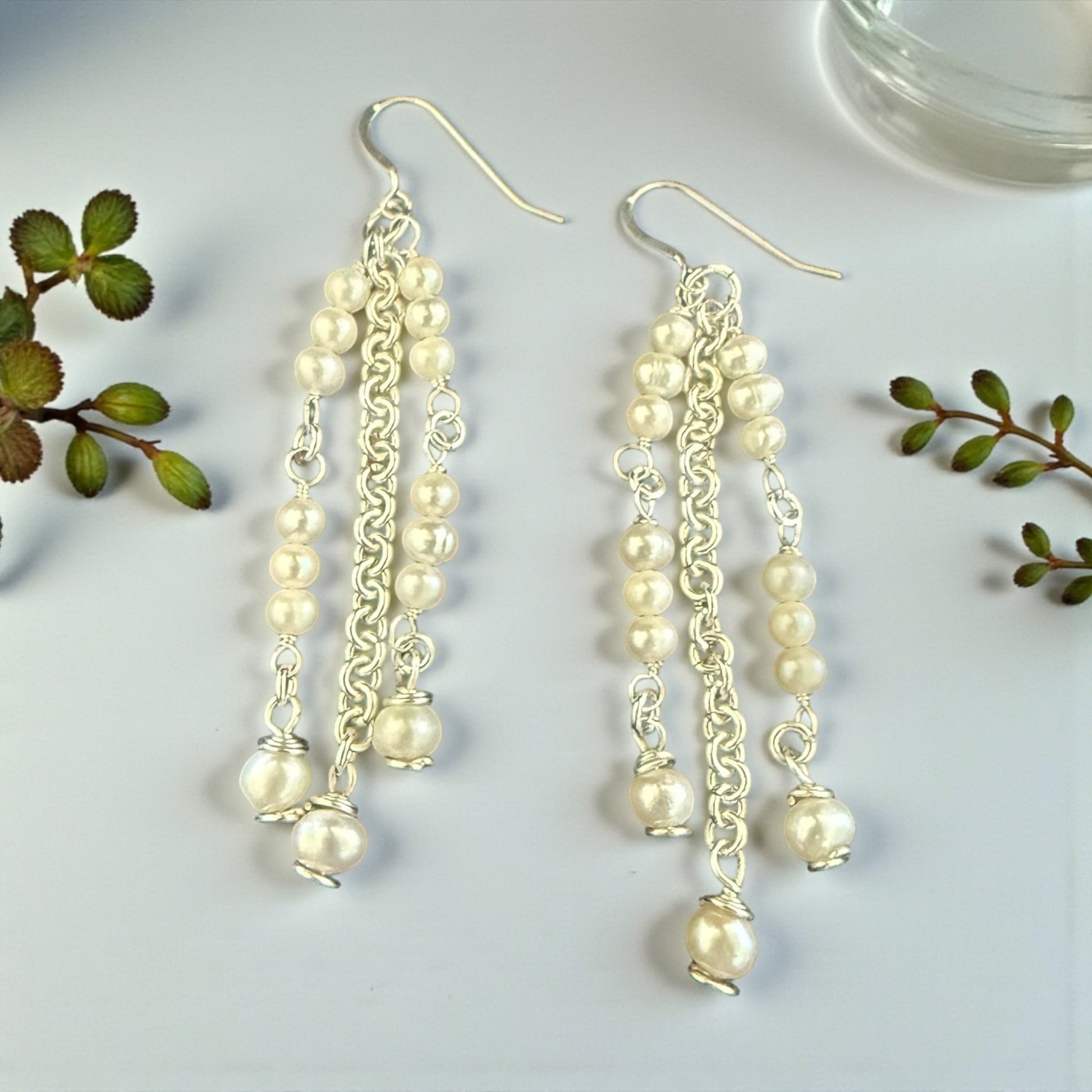 Jena Jewelry cascading freshwater pearl bridal earrings with silver-tone chains and luminous pearls.