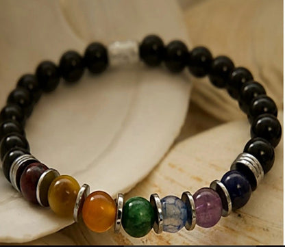 Jena Jewelry Chakra Stretch Bracelet with black onyx, ruby red jade, golden tiger eye, orange jade, green aventurine, lapis, amethyst, and hematite beads.