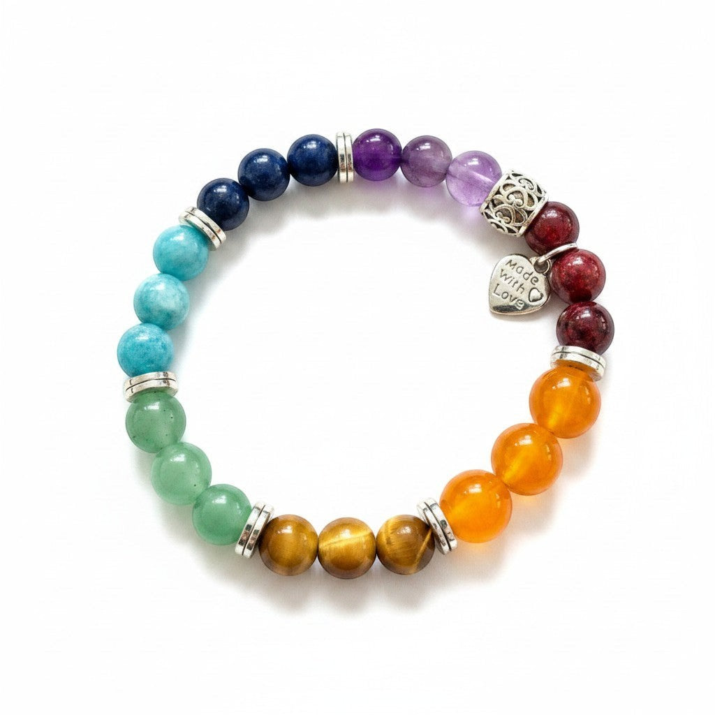 Jena Jewelry Chakra Stretch Bracelet with red jade, orange jade, tiger eye, green aventurine, lapis, amethyst, and hematite beads. Features a 'Made with Love' charm.