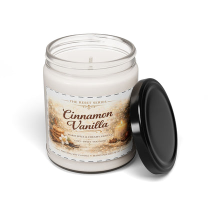 Jena Jewelry Cinnamon Vanilla natural soy candle in a clear glass jar with a black lid. Cozy fall home fragrance.