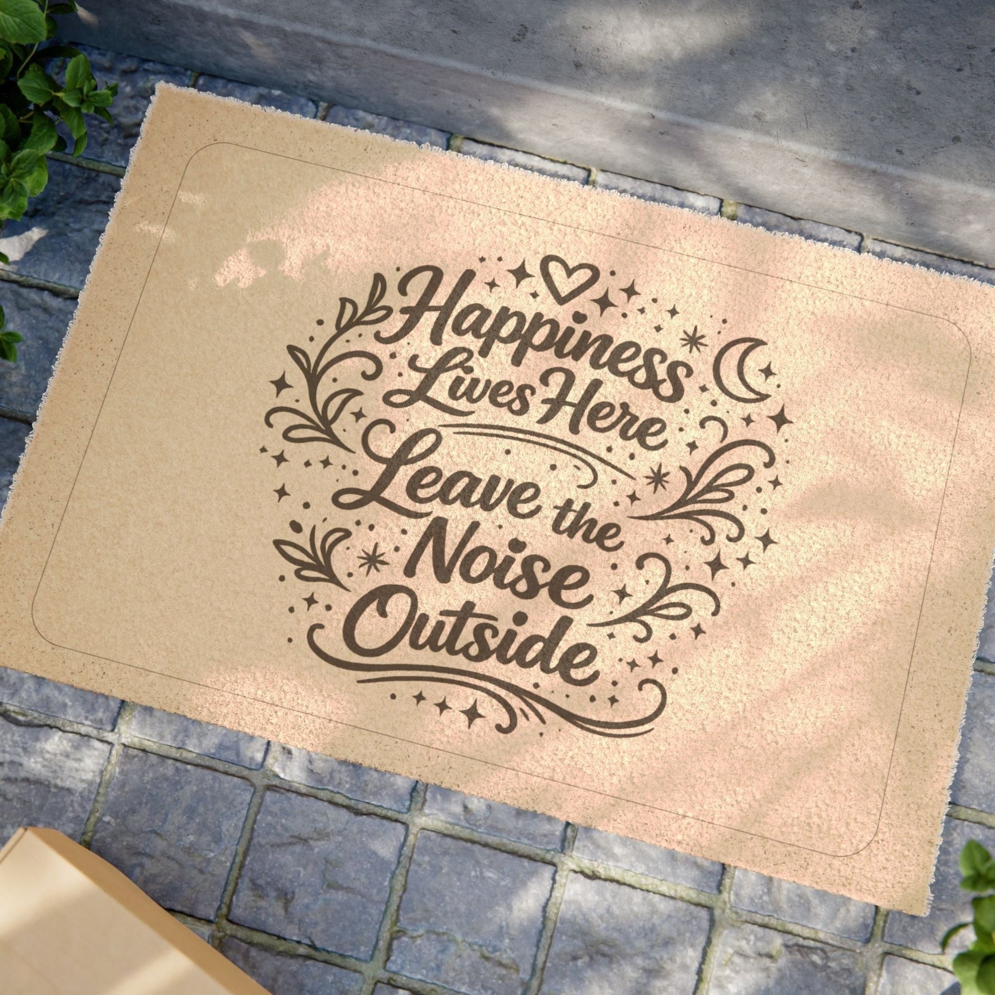 Jena Jewelry coir doormat with "Happiness Lives Here Leave the Noise Outside" text in dark brown script.
