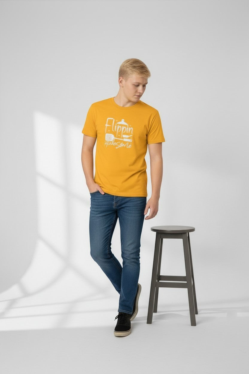 Jena Jewelry men's mustard yellow 100% cotton t-shirt with 'Flippin Awesome' graphic and cooking icons.